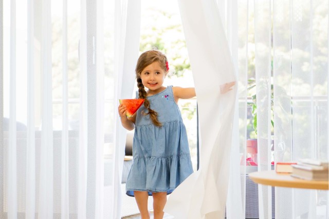 Both cellular shades and curtains offer child-safe window treatment